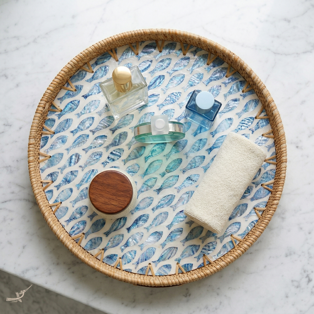 Escalia - Round tray in handmade rattan and mother-of-pearl, fish school pattern – in-use view – Handcrafted product, handmade · Kuênia
